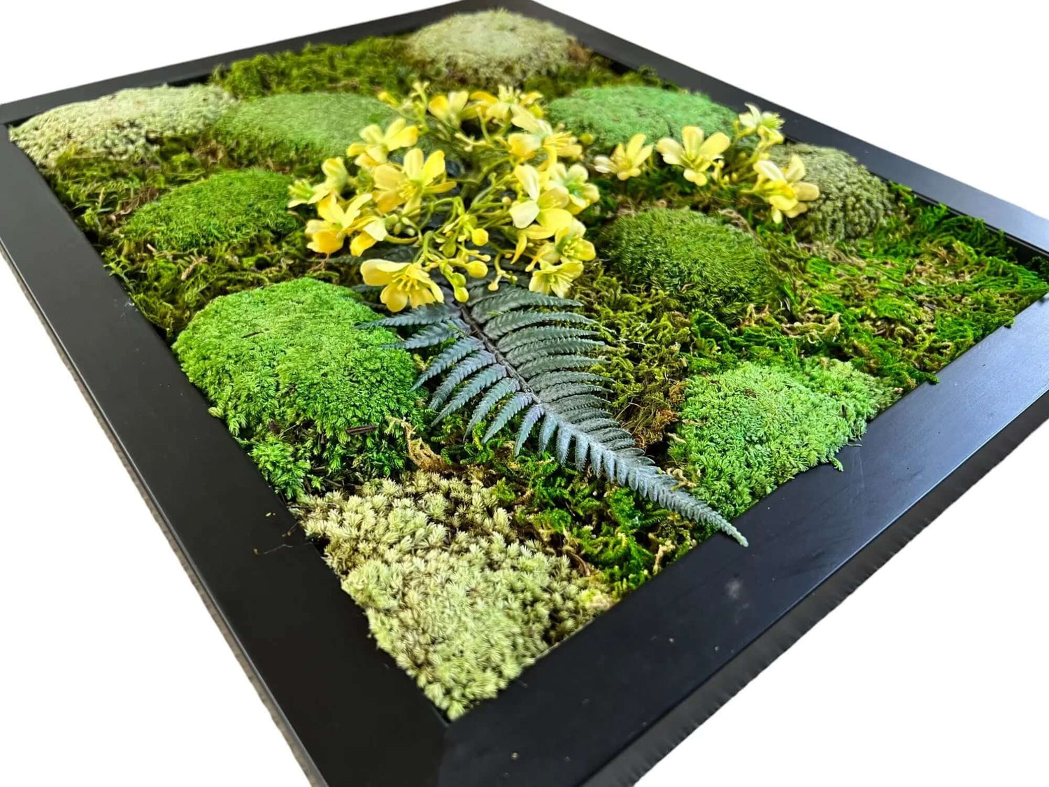 Close-up of preserved moss wall art, showcasing the texture and variety of green hues. artifical flower with yellow color