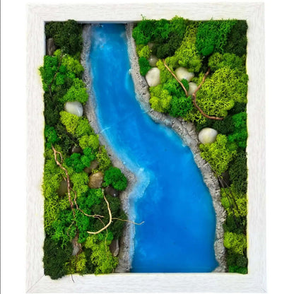 a single image of wall decor contains variety of green color preserved moss with sky blue color epoxy resin and rock stones in rectangular shape 